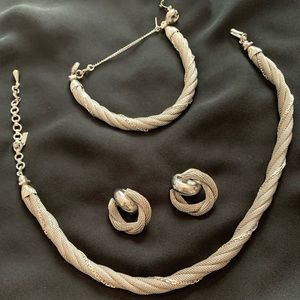 Silver Matching Necklace, Bracelet, and Earrings.